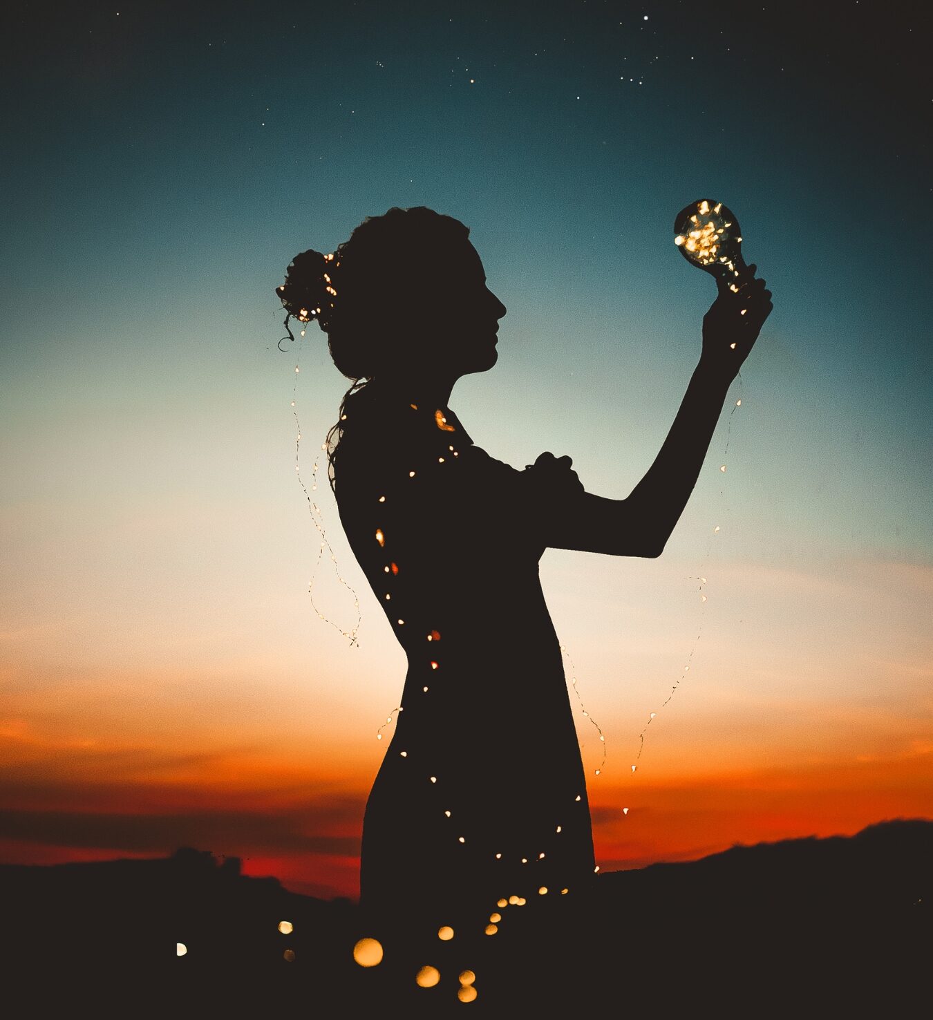 silhouette of a woman with a light